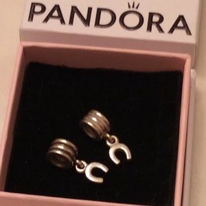 Two Pandora Retired horseshoe charms